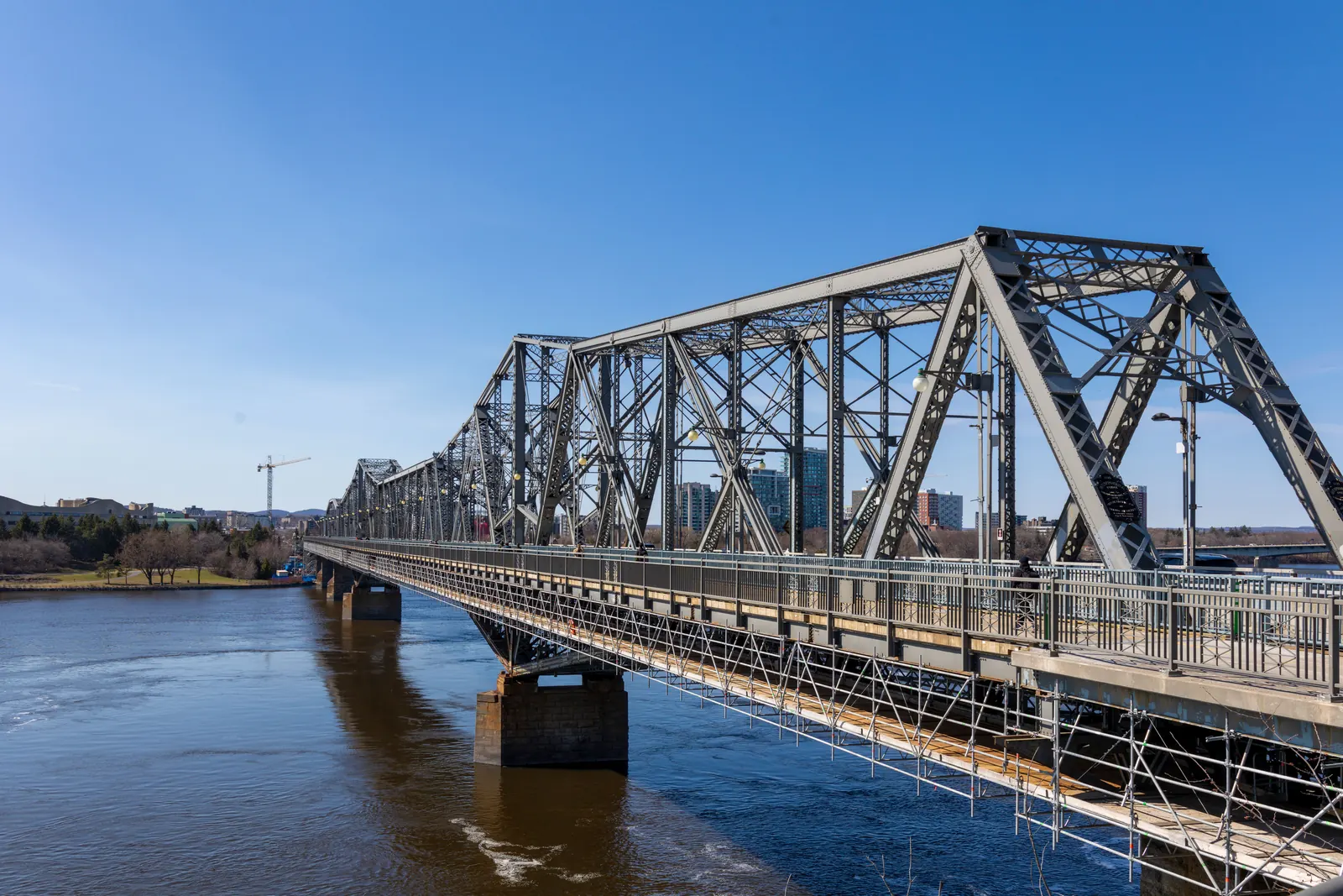 When will mortgage rates go down in Canada, shown by the Alexandra Bridge over the Ottawa River under a clear sky